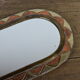 Decorated brass mirror.