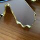 Vintage sun mirror in 60s/70s gold resin