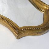 Antique Louis XV style mirror, vintage carved gilded wooden frame with pearls