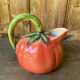 Jug in tomato slipware