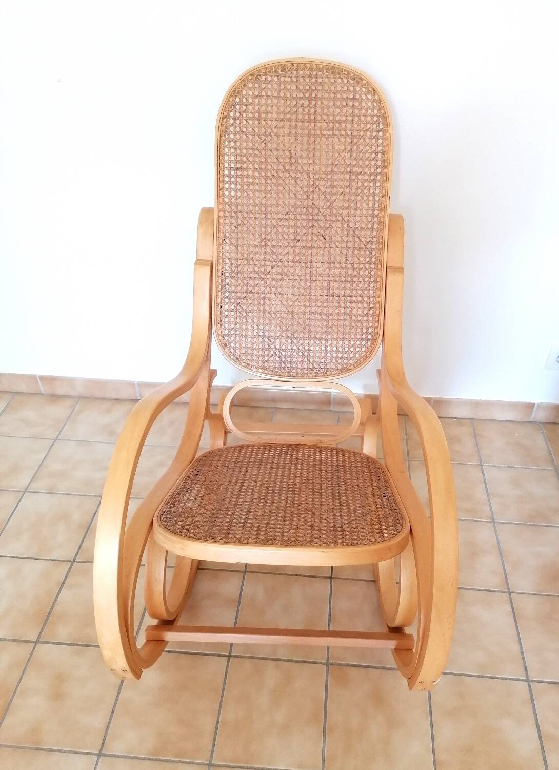 Wooden and cane rocking chair