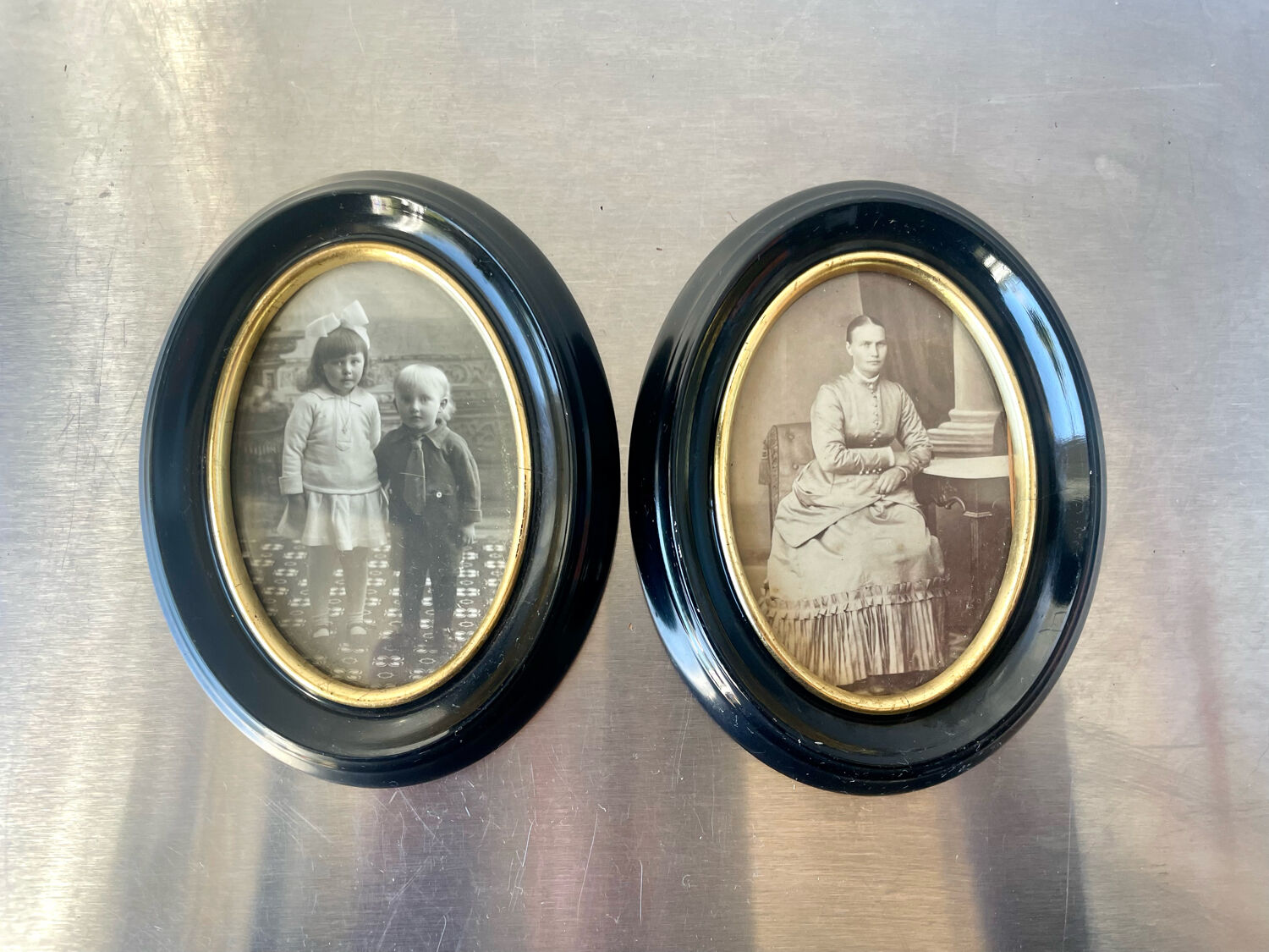 Pair of black wooden oval frames 1880’s  each 13 cm x 10 cm glass measurements 8.5 cm x 5.5 cm