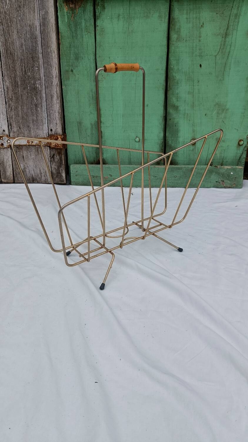 Vintage magazine rack in golden brass