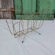 Vintage magazine rack in golden brass
