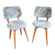 Pair of moumoute chairs with compass feet