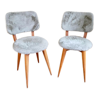 Pair of moumoute chairs with compass feet