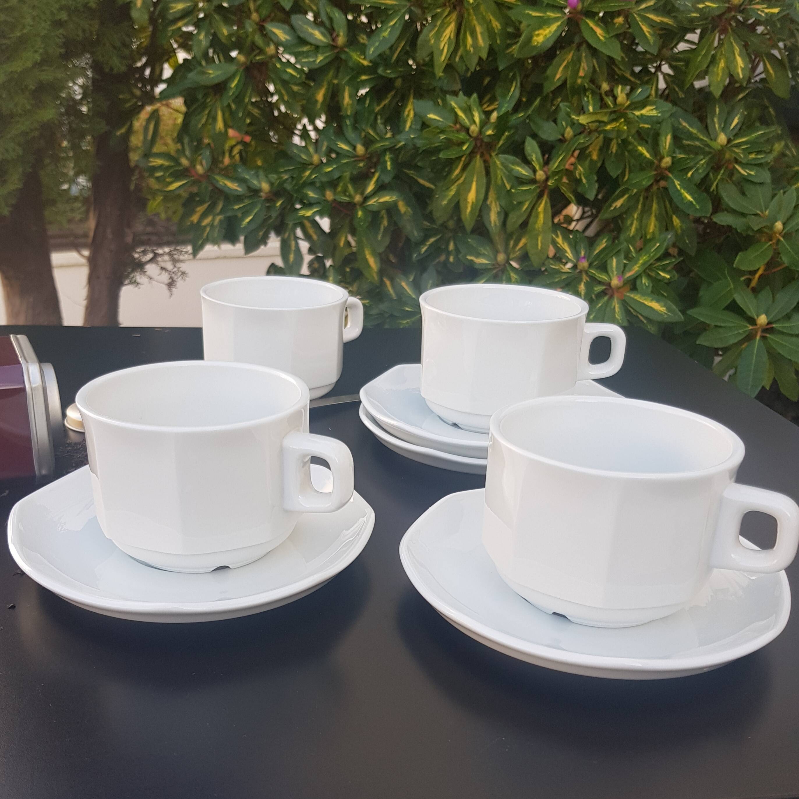 4 White cups and saucers