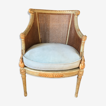 Fauteuil de style louis XVI en bois patiné et doré fond de cannage