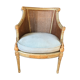 Stunning Louis XVI style armchair in patinated and gilded wood, canning background