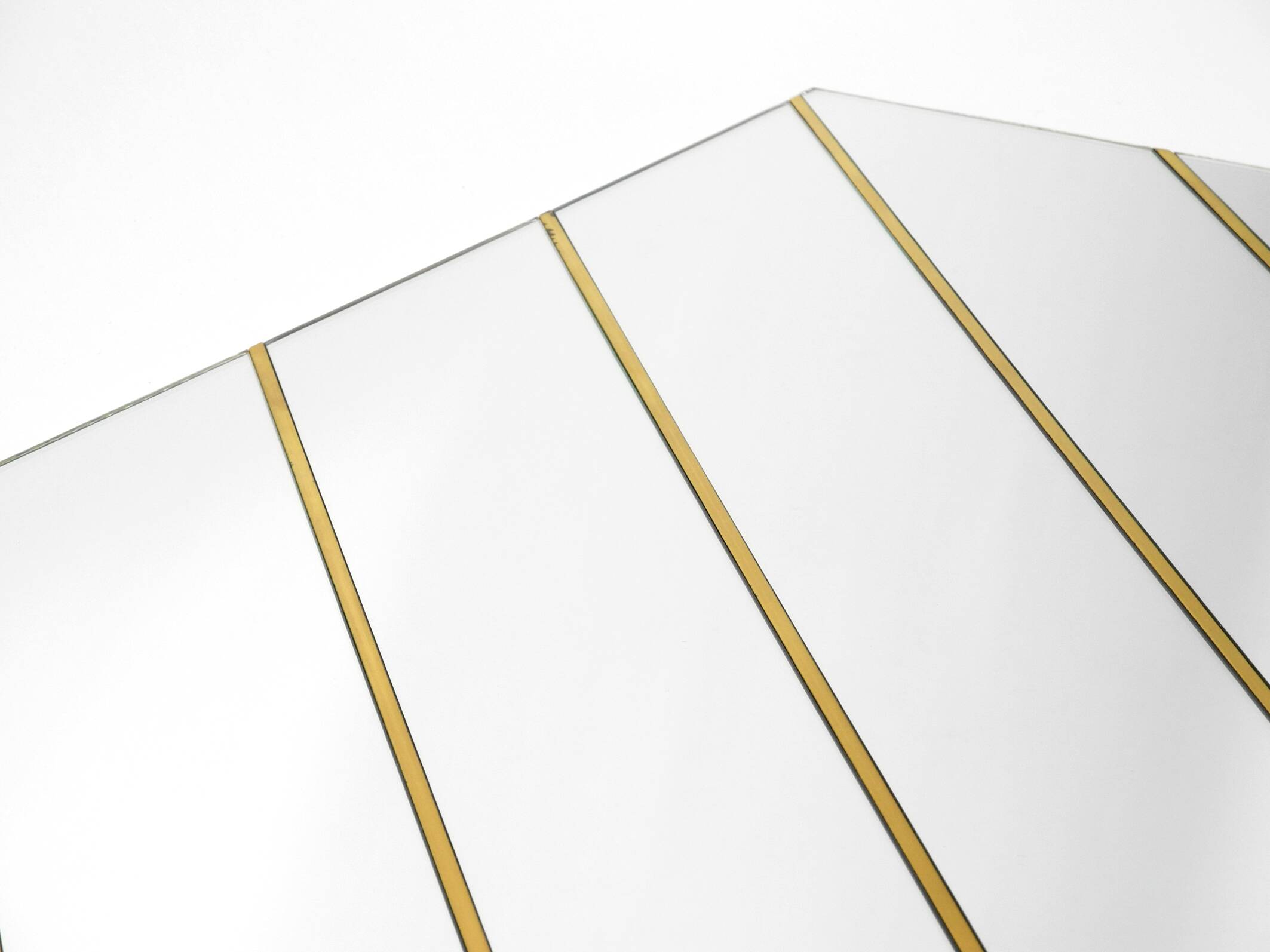 Large, exceptional 1970s brass wall mirror with diagonal mirror strips