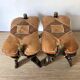 Pair of low Egyptian stools, camel saddles in wood, leather and brass