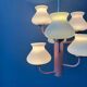 Mid-century opaline glass chandelier with a pink structure.