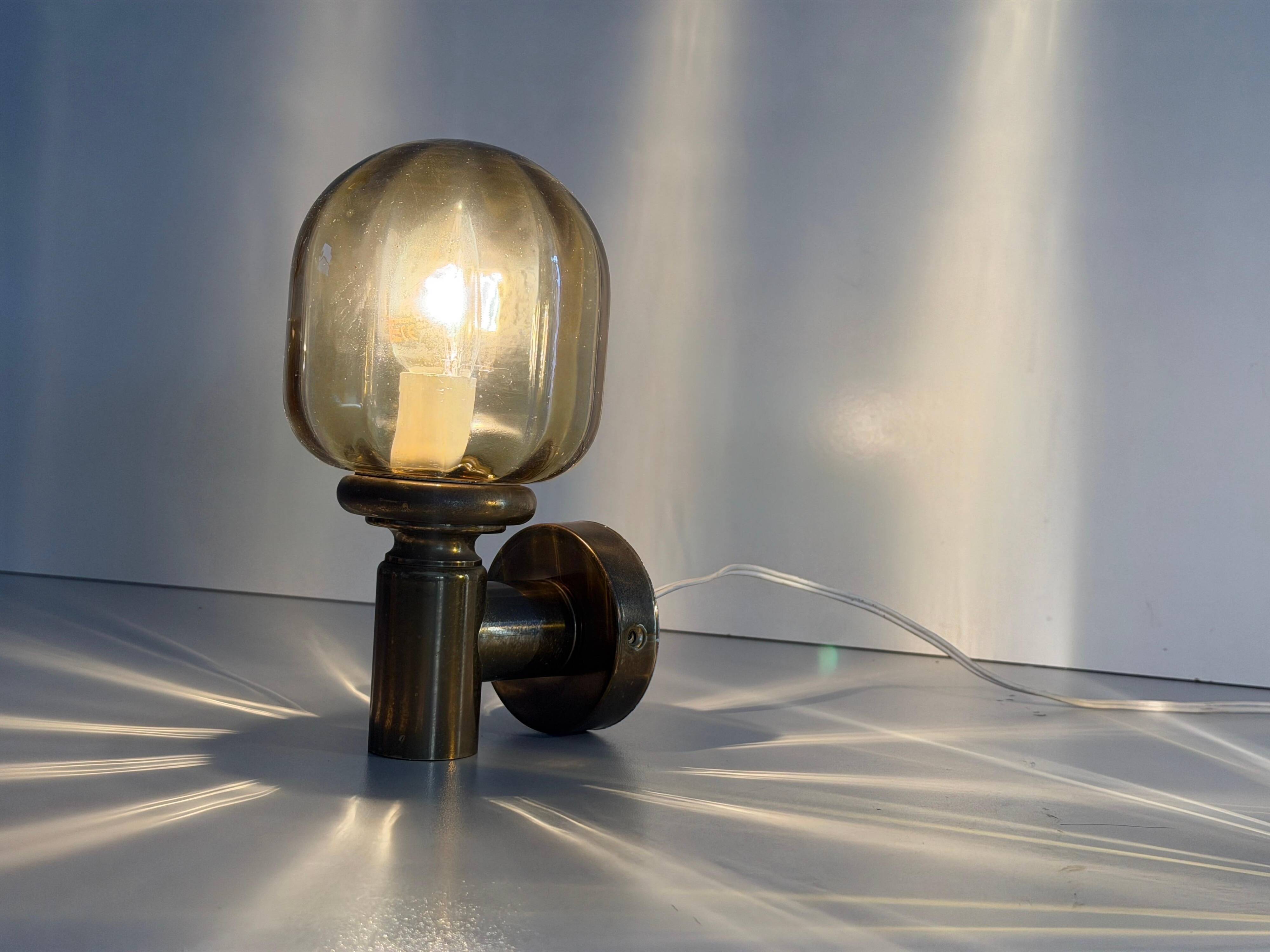 Pair of yellow glass and brass wall lights from the mid-century by N Leuchten, 1960s, Germany.