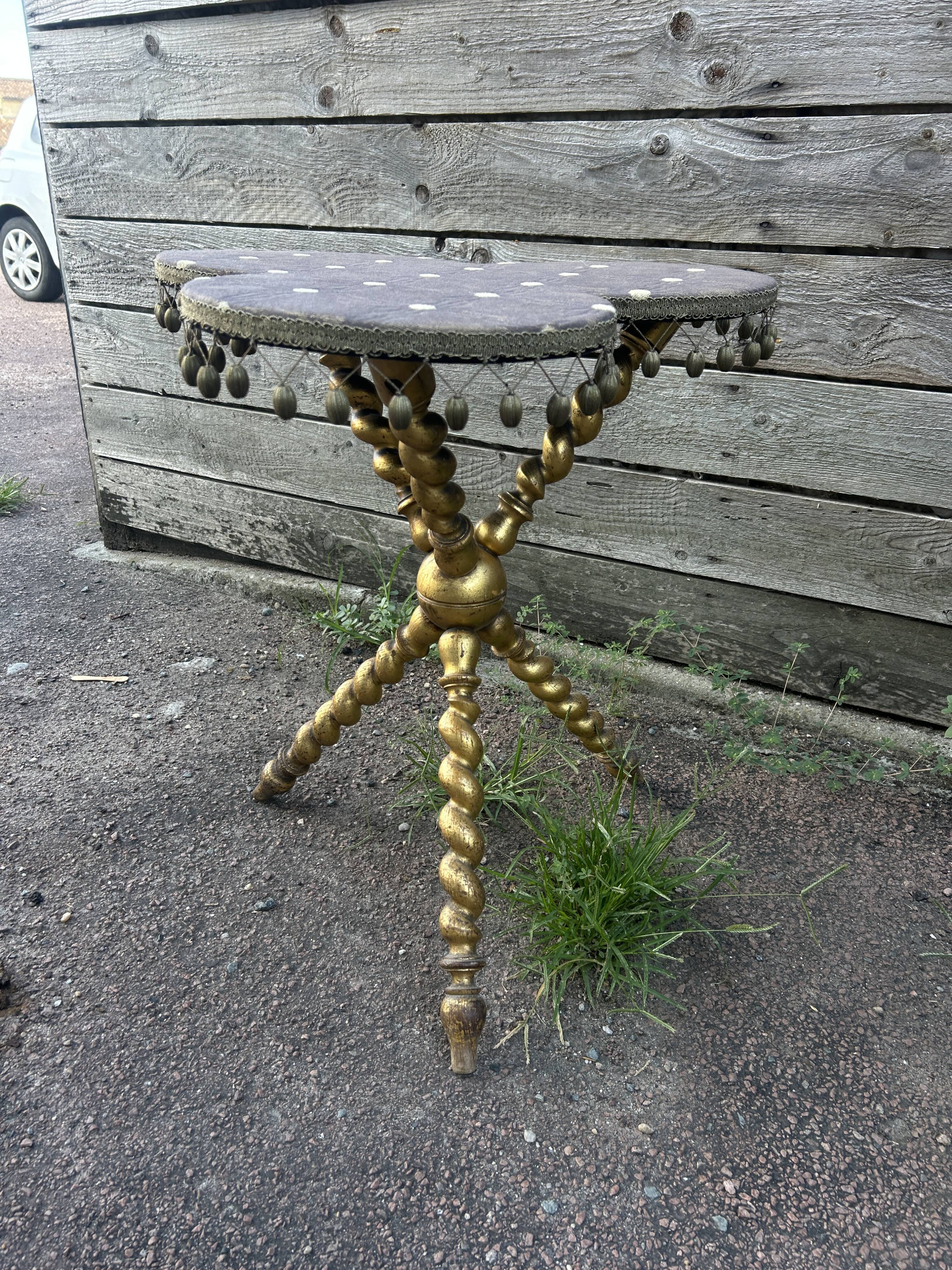 Louis XIII style gueridon, gilded legs, trilobed top.