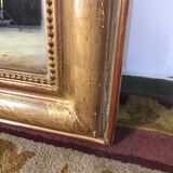 Louis Philippe's era mirror with a gold leaf pediment