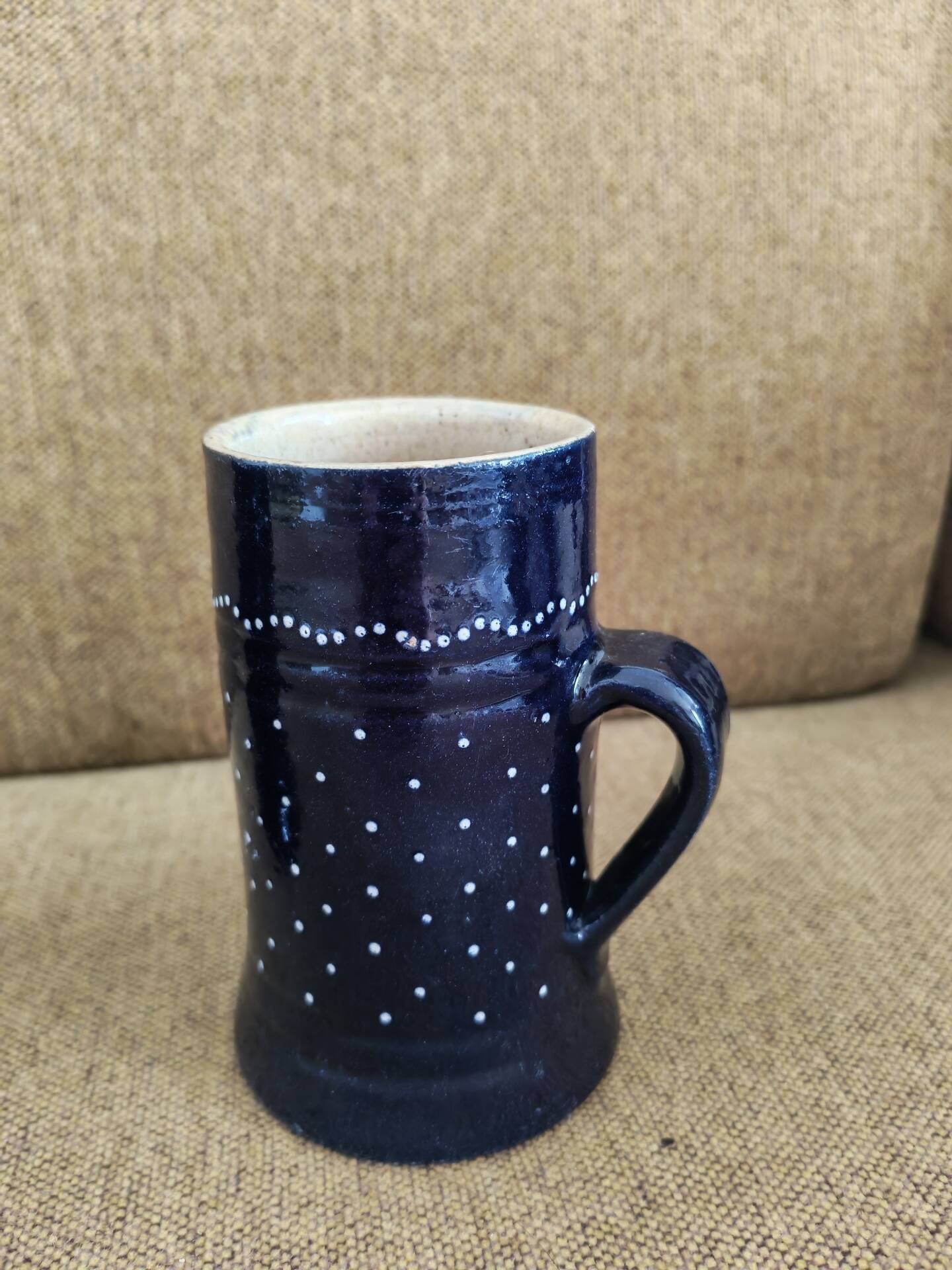 Two vintage mugs in traditional German earthenware.