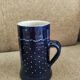 Two vintage mugs in traditional German earthenware.