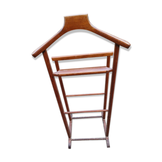 Valet wearing double wood coat rack
