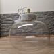 Glass globe pendant light with marble