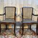 Pair of wide caned armchairs from the Art Nouveau period.