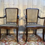 Pair of wide caned armchairs from the Art Nouveau period.