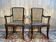 Pair of wide caned armchairs from the Art Nouveau period.