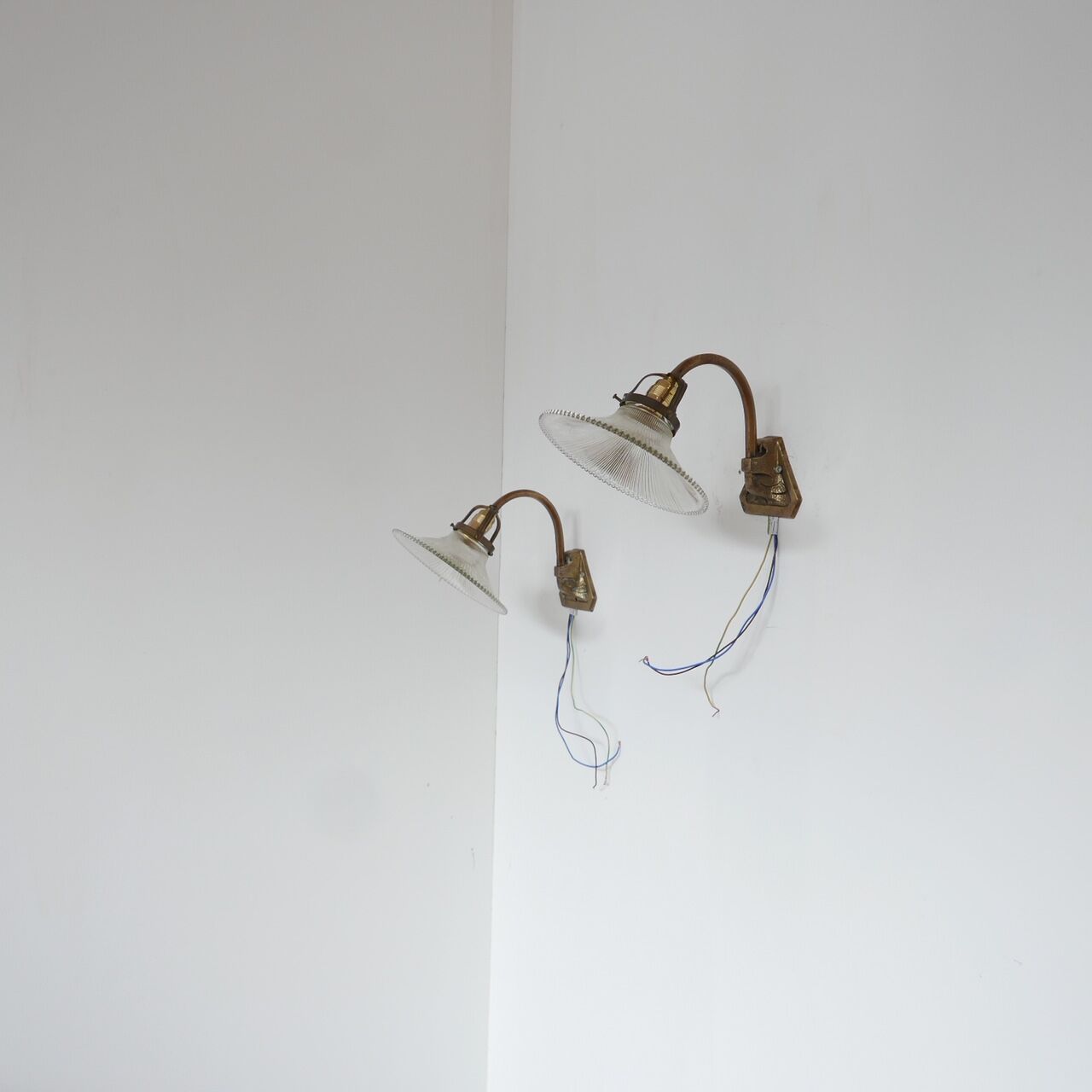 Pair of brass and glass wall sconces