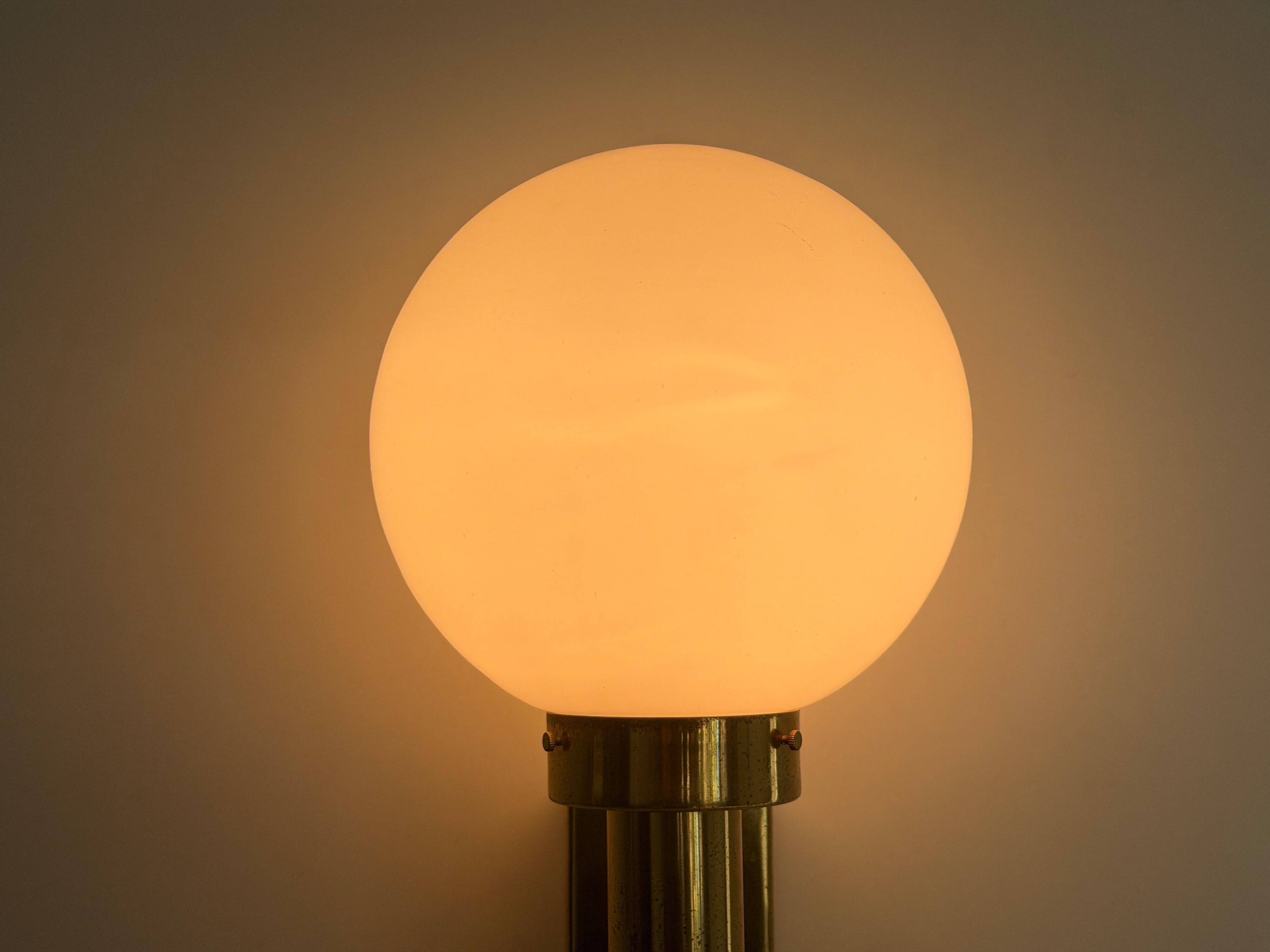 Large minimalist cinema wall light in opal glass and heavy brass, 1960s, Germany