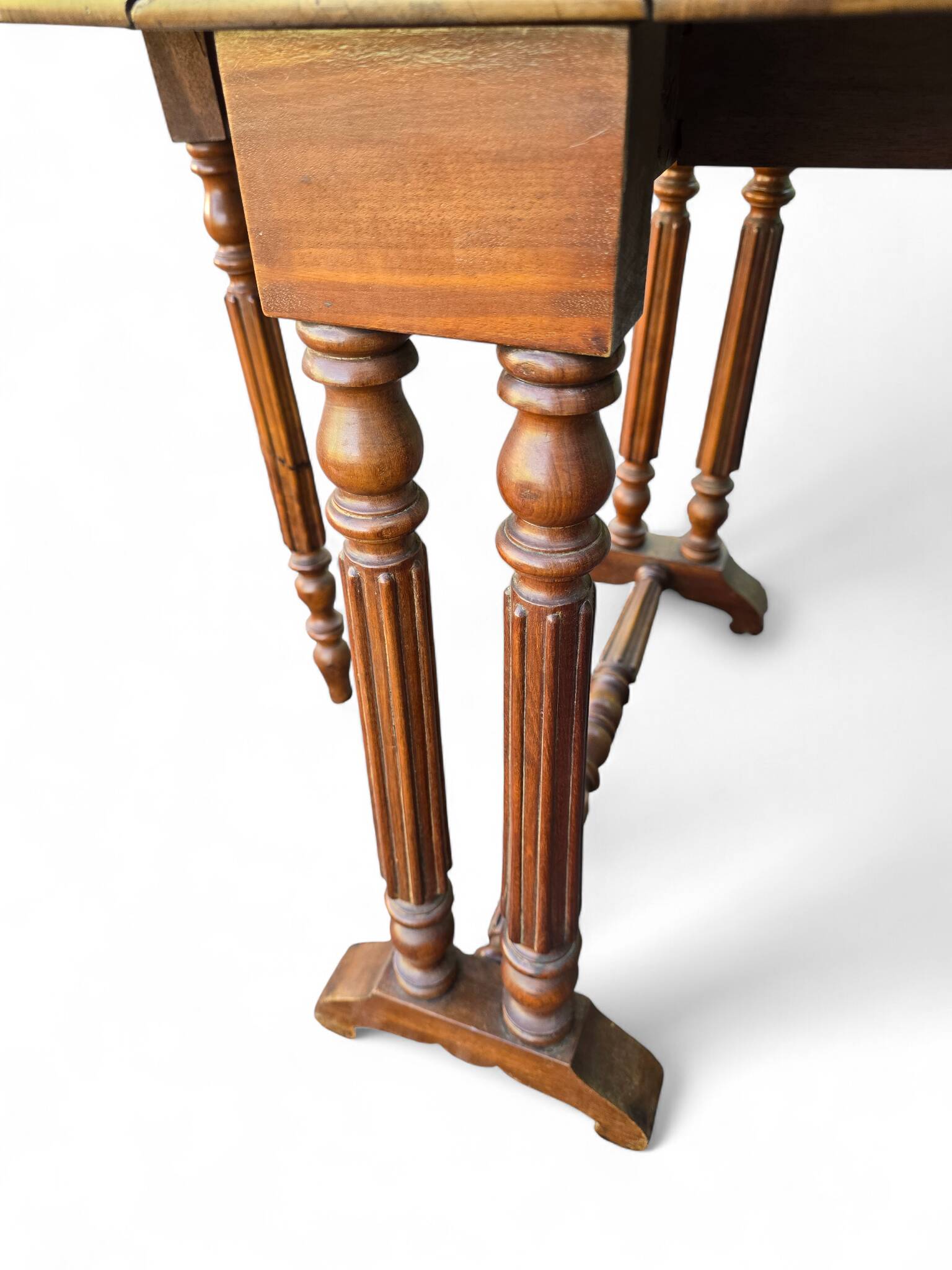 “Gateleg” folding walnut table