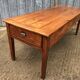 Antique farmhouse table in solid cherry wood with 3 drawers and 1 pull-out.
