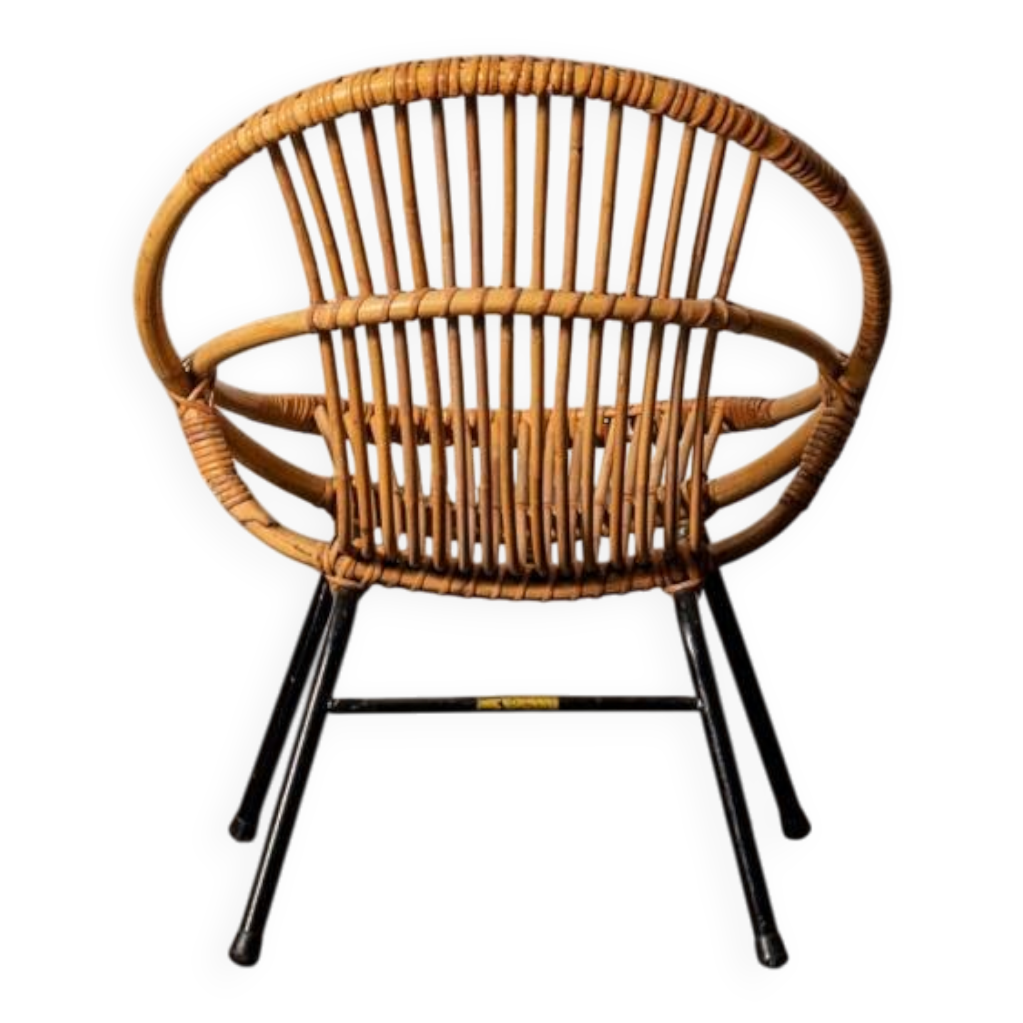 Rattan armchair with metal legs