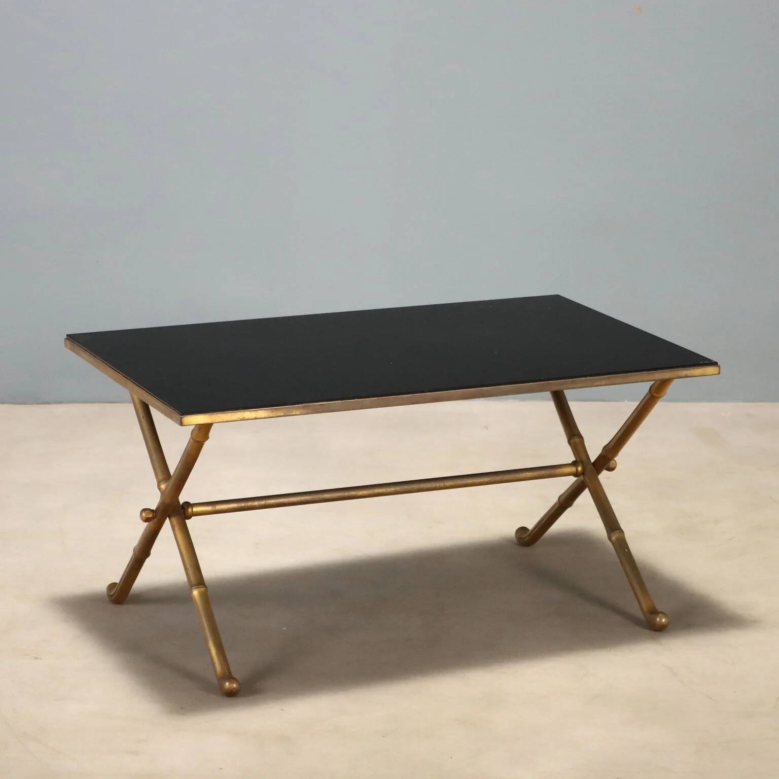 Coffee table from the 1950s-60s with a brass base.