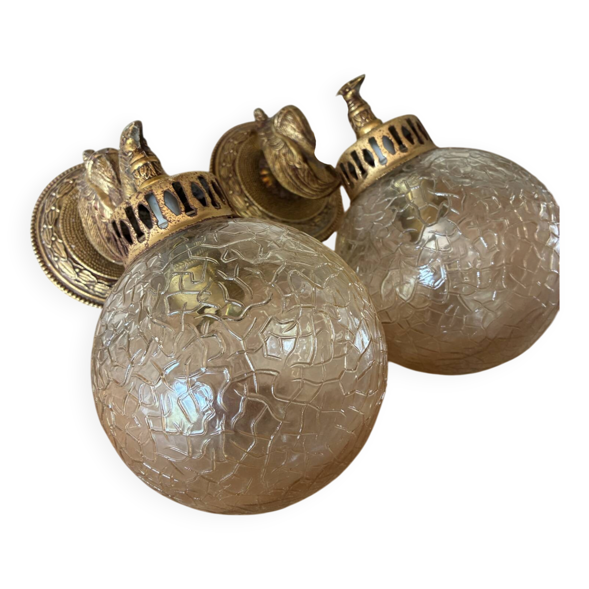 Pair of vintage wall sconces with golden metal swan heads and glass.
