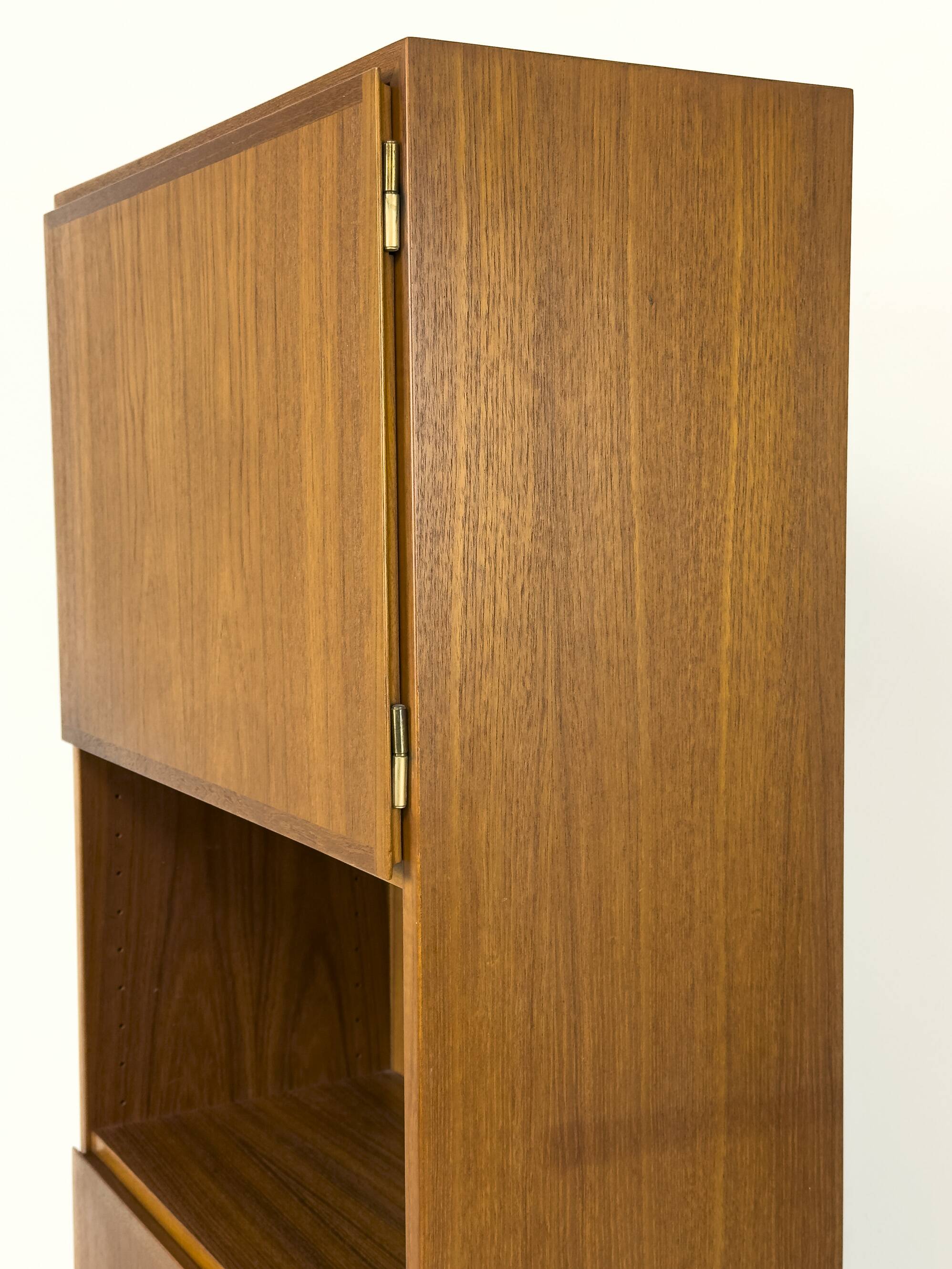 Narrow teak bookcase with two doors by Omann Jun, 1970s