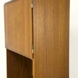 Narrow teak bookcase with two doors by Omann Jun, 1970s
