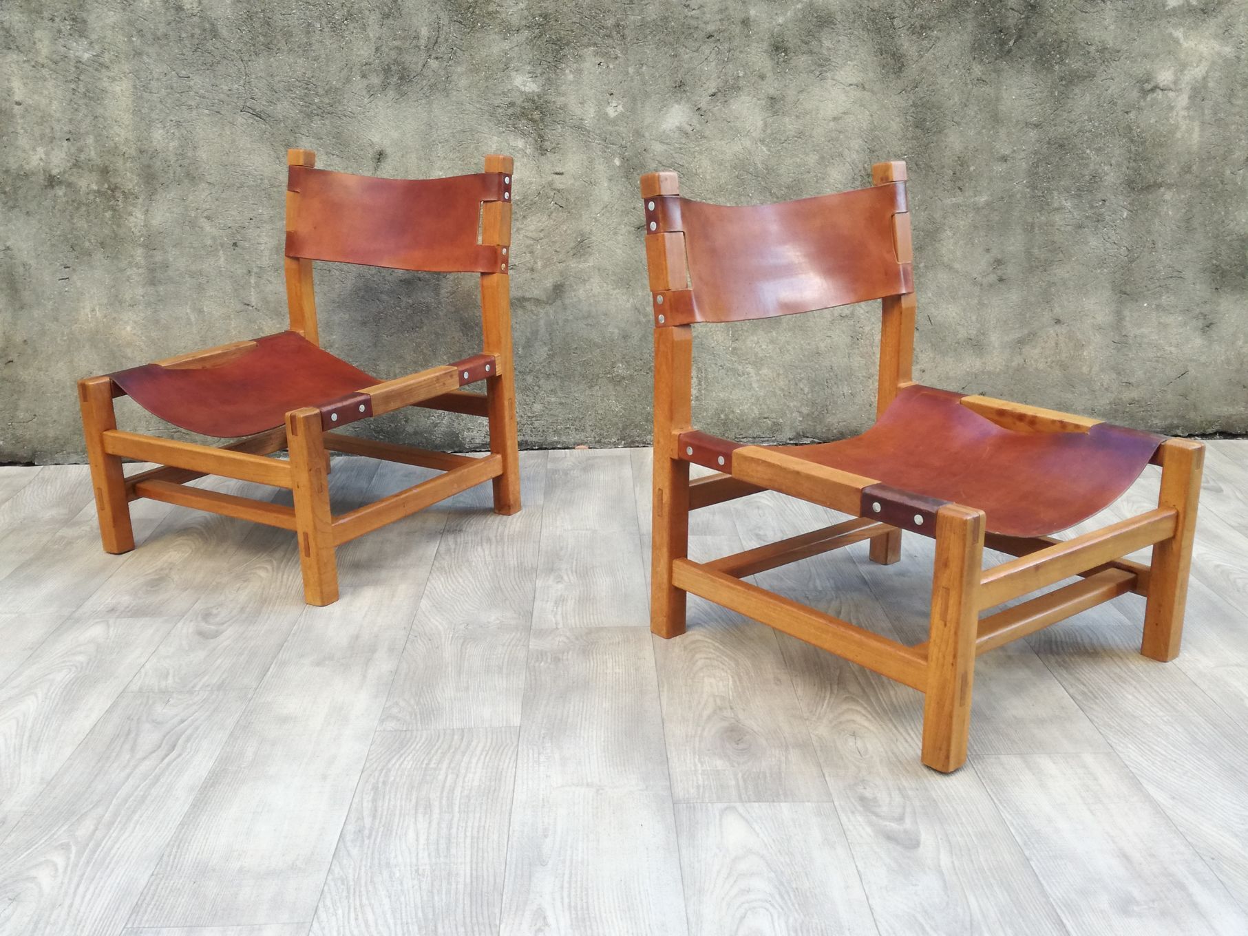 Pair of elm and leather heaters by Maison Regain, 1960s