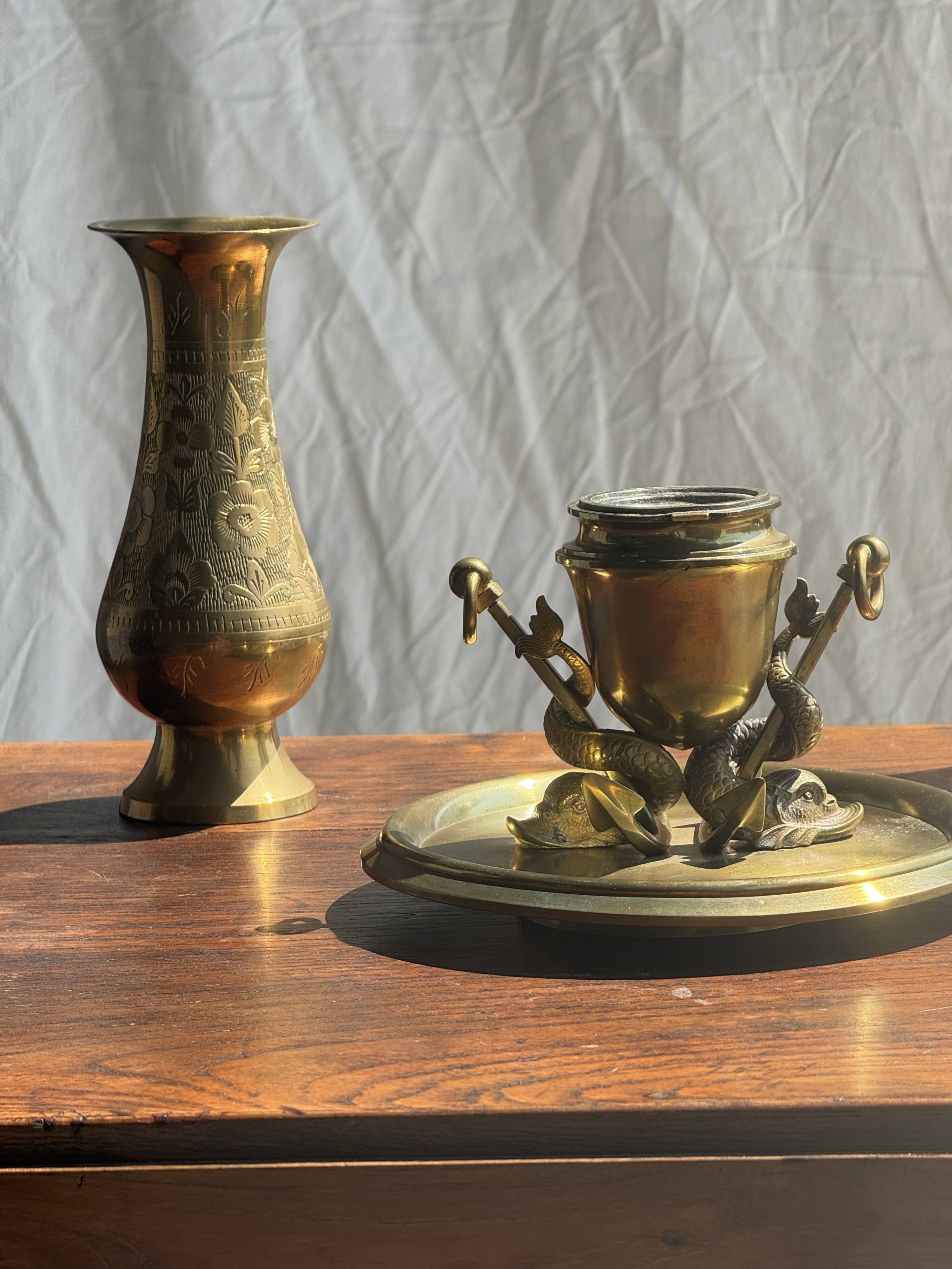 Large 19th century brass candlestick with dolphin motifs