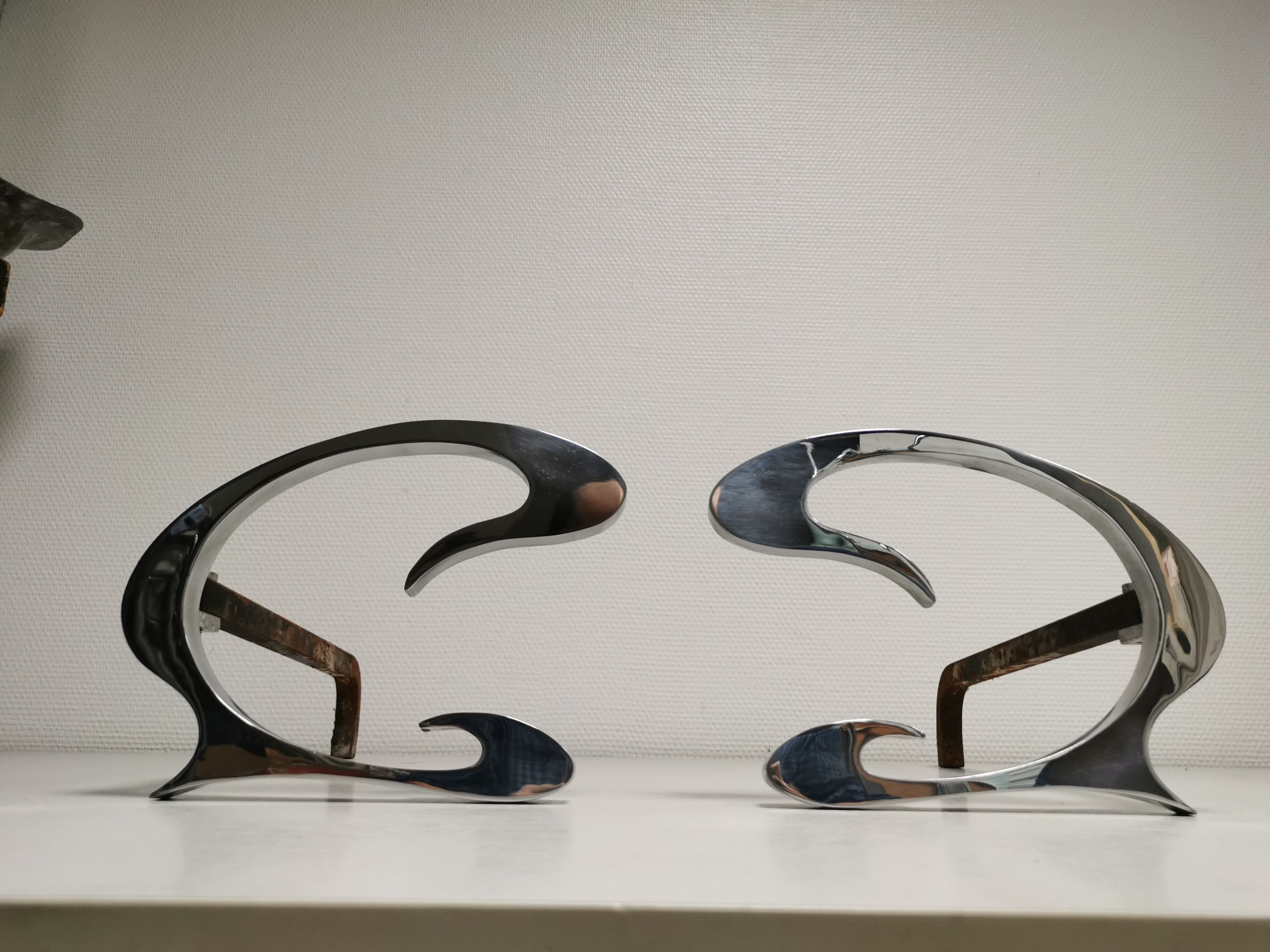 Pair of andirons in brushed steel and metal edition Jean-Paul Créations circa 1970