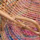 Fauteuil vintage « coquille » en rotin
