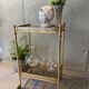 Gilded brass table and glass