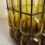 Glass carafe encased in wrought iron