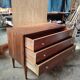 Vintage commode with tapered legs.