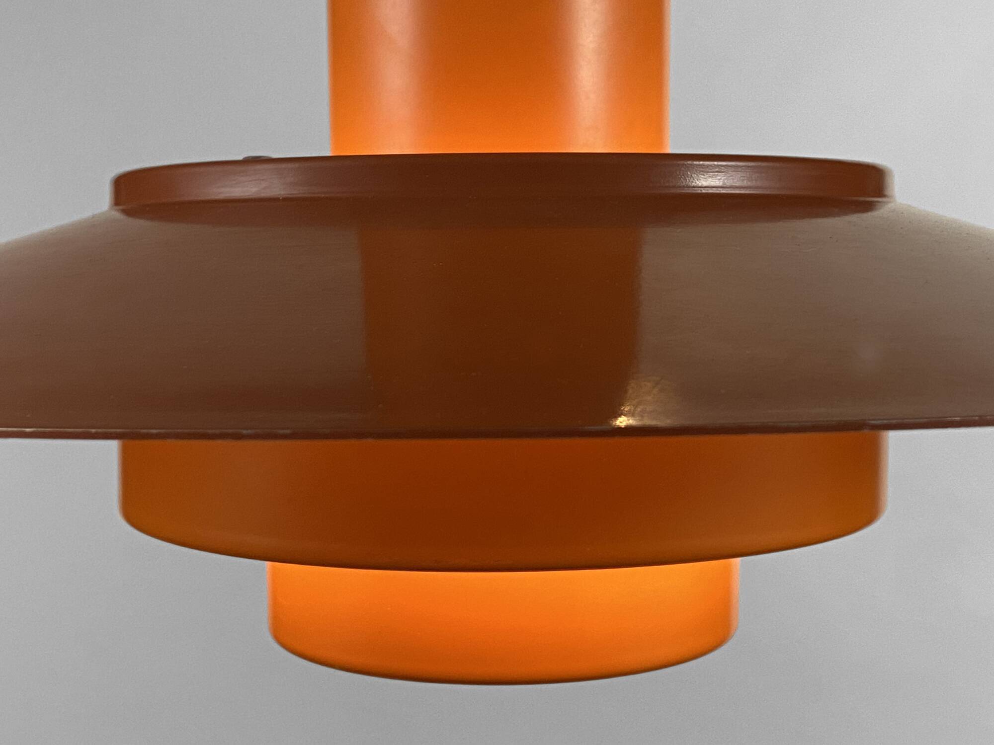 Pendant light "Falcon" two tone orange by Andreas Hansen for Fog & Mørup. Denmark 1960s.