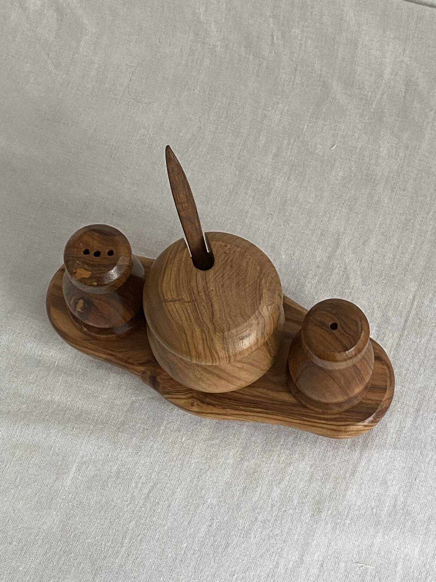 Condiment service (salt, pepper, and mustard) in olive wood