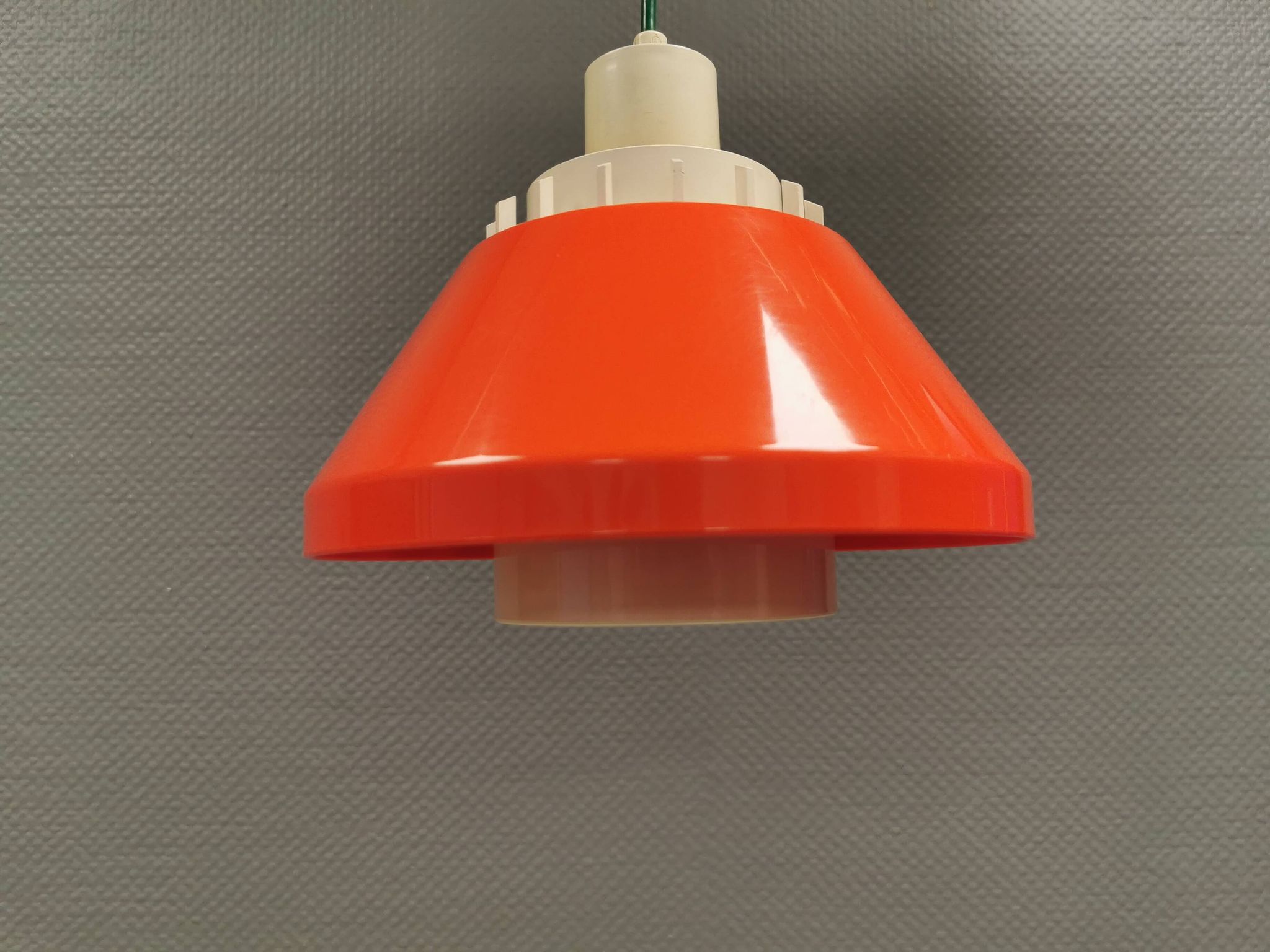 An orange pendant lamp made from hard-pressed ABS plastic. Denmark 1970s