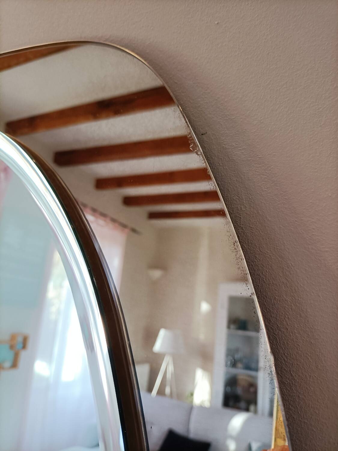 Vintage oval smoked glass mirror