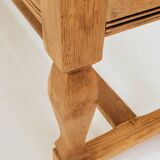 Vintage oak bench with striped linen fabric in a country style.