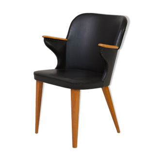 Scandinavian black leatherette chair with armrests