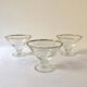 Trio of glass dessert bowls with gold rims, La Rochère, France