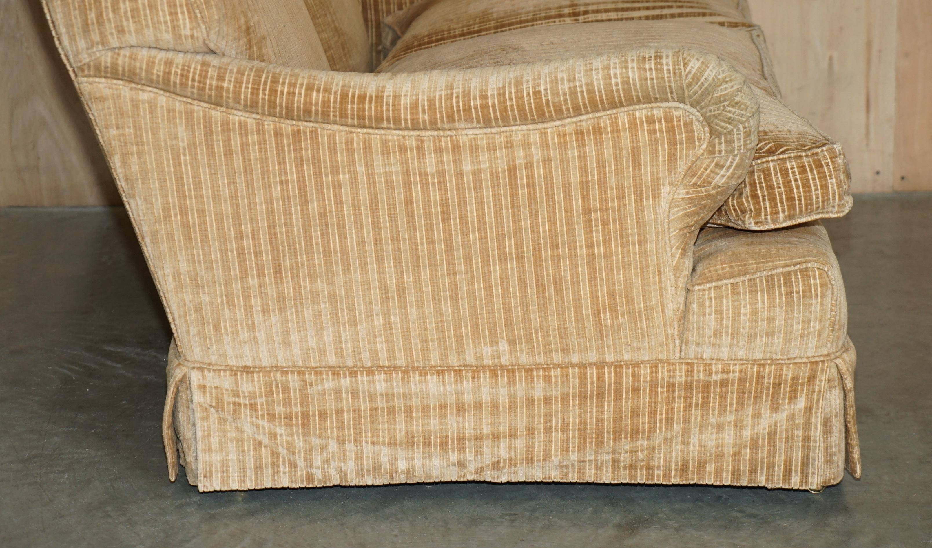 Howard & Sons / Chairs Ltd two-seater canapé with feather-filled cushions.